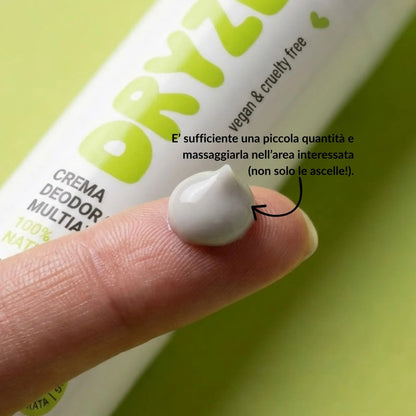 Dettaglio della texture in crema del deodorante naturale Dryze su un polpastrello, evidenziando la facilità di applicazione e la formula vegana.